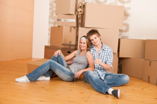 Student removals team loading boxes and furniture in Streatham