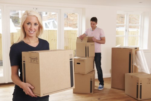 Removal team preparing boxes and equipment safely before a move