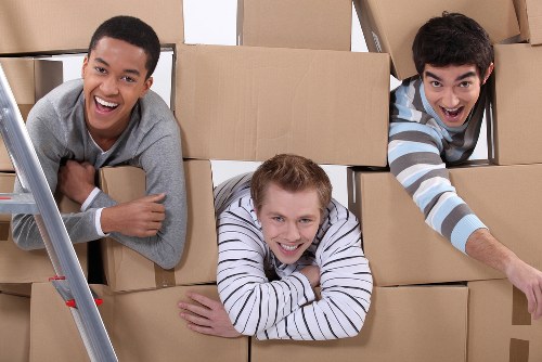 Packed office equipment and furniture ready for relocation