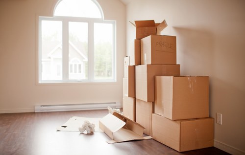 Unpacked boxes being organized in a new Streatham home