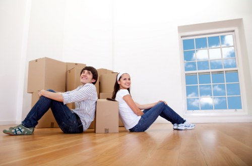 Removal team loading household items into a moving van