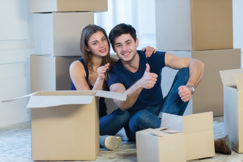 Professional movers carrying furniture during a same day relocation in Streatham