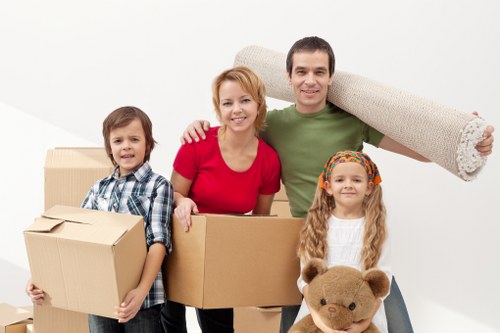 Specialist movers handling a piano in a Streatham property