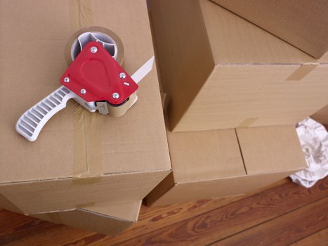 Loading furniture into a moving truck in Streatham