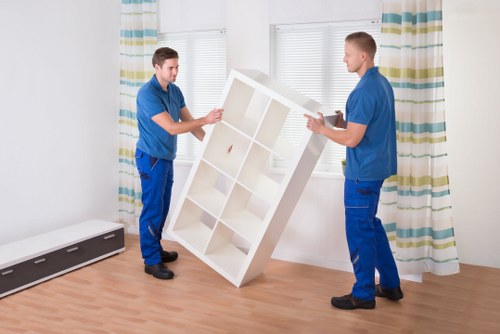 Professional movers packing boxes for a Streatham relocation