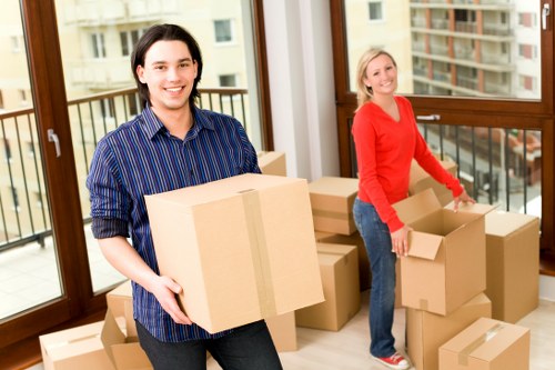 Insured removals staff working carefully in a residential property